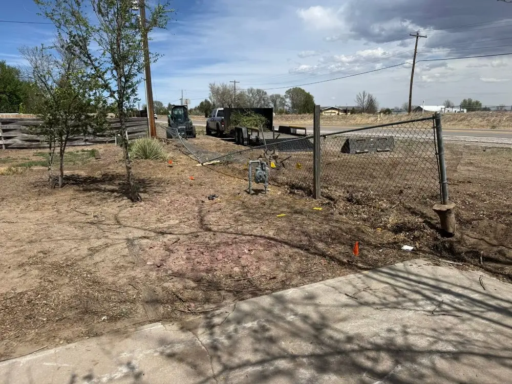 Before: old chain-link fence, then a new wood privacy fence in the same yard